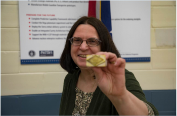 Donna Riggs works at Y-12 National Security Complex for the the NNSA Production Office. She stamped the first production unit of the B61-12's canned subassembly to indicate it was certified.