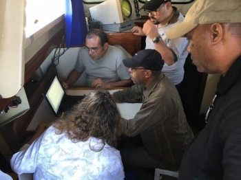 Members of the Argentina team surround an NNSA employee while monitoring for radiological and nuclear threats at the G-20 Summit in December 2018.