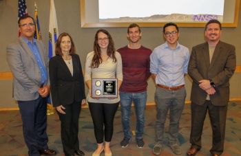 Nevada National Security Site Experiment Analysis team members accept award from Dr. Kathleen Alexander (second from left).