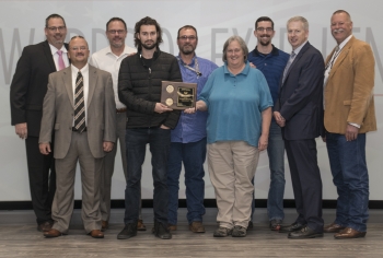 Pantex B61 nuclear explosive package trainer process development team accepts their award.