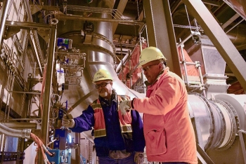 Employees at Hanfordâs Waste Treatment and Immobilization Plant (WTP) inspect a system equipment tag inside the plantâs Analytical Laboratory.