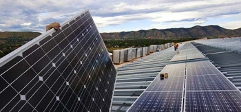 Photo of solar panels being installed.