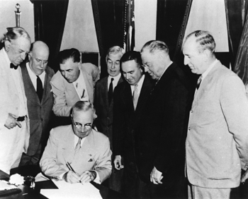 President Harry S Truman signs the Atomic Energy Act of 1946 establishing the U.S. Atomic Energy Commission. President Harry S Truman signs the Atomic Energy Act of 1946 establishing the U.S. Atomic Energy Commission.