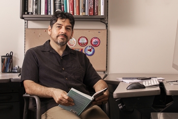 Los Alamos Lab Engineer Donald Sandoval with his loom.