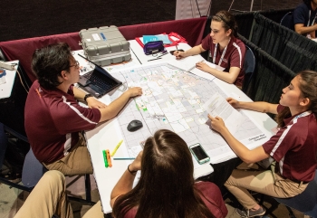 Students work on their siting plans for wind turbines in their team booths at the Collegiate Wind Competition 2018 n Chicago on May 9, 2018.