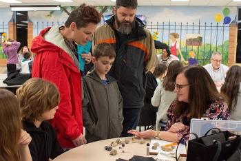 Elizabeth Phillips talks with students about her work as a geologist at the Oak Ridge Office of Environmental Management. She helped them examine the difference between fossils, minerals, gold, and foolâs gold.