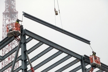 Contractors place the last piece of structural frame on the Mechanical Electrical Building at the Uranium Processing Facility at Y-12 National Security Complex in Oak Ridge, Tennessee.