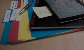 photo of acquisition folders sitting on desk