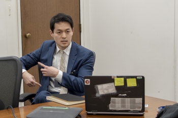 Michael Yo tells fellow employees about his international efforts during a lunchtime event in Washington, D.C.