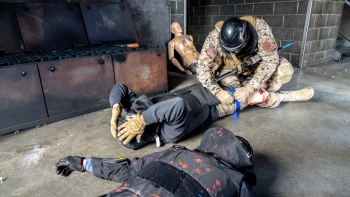 One participant in the NNSA active shooter exercise at the Hanford Site said the intense realism is what made the exercise effective. Here, an officer applies a tourniquet to a role player once the immediate threat has been eliminated.