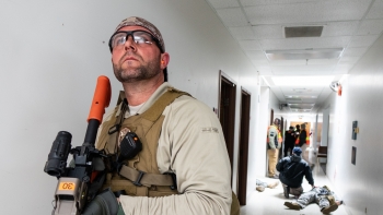 The workshop was designed to address inconsistencies among active shooter and workplace violence plans at NNSAâs labs, plants, and sites. Here, a participant establishes hallway security in a âwarm zoneâ to allow entry by a rescue task force.
