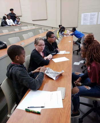Renaissance Learner students talk about problem solving during Field Day at Claflin University. Renaissance Learner students talk about problem solving during Field Day at Claflin University.