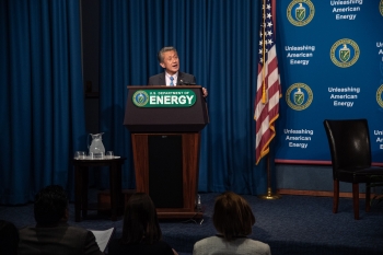 Special Secretary Jimmy Rhee speaks at the podium.