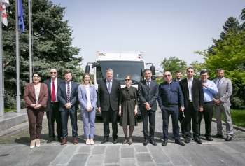 Georgiaâs Deputy Minister of Environment Protection and Agriculture and the head of Georgiaâs Agency of Nuclear and Radiation Safety are joined by U.S. and U.K. partners in front of the secure truck.