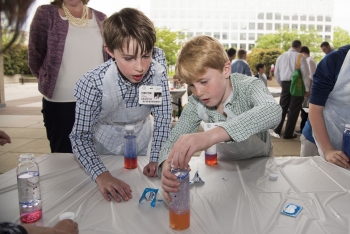 Children create lava lamps with oil, water, food coloring and sodium bicarbonate