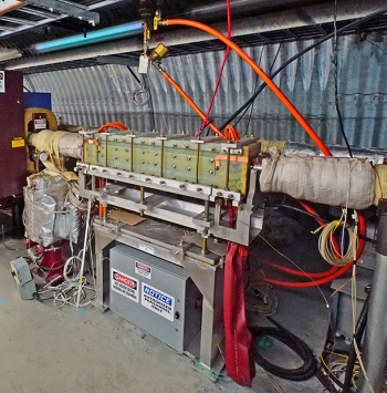 The spin flipper magnet assembly resides inside a tunnel that houses the Relativistic Heavy Ion Collider at Brookhaven National Laboratory. The spin flipper magnet assembly resides inside a tunnel that houses the Relativistic Heavy Ion Collider at Brookhaven National Laboratory.