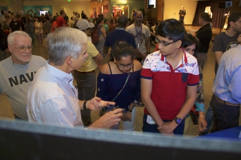 Dr. Steve Azevedo explaining Lawrence Livermore National Laboratory's technologies to museumgoers during Military Invention Day at the National Museum of American History.