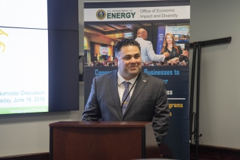 Honorable James E. Campos smiling at the podium