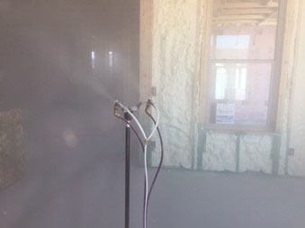 Photo of an aerosol spray in a building.