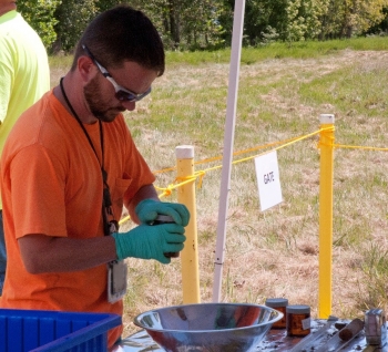 A technician with PPPO's Portsmouth Environmental Monitoring Program prepares an environmental media sample for analysis.
