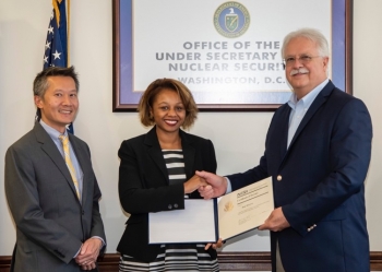 Dr. William Bookless, Principal Deputy Administrator of NNSA and Steven Ho, Director, Cost Estimating and Program Evaluation, presented Betty T. Morrison with a certificate for your 20 years of service in the federal government.