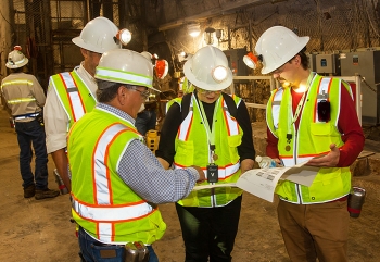 Members of a panel of mine experts tour the underground at the Waste Isolation Pilot Plant on a visit to the facility this month.