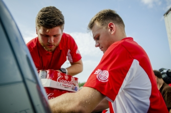 DOE Interns Kyle Garner and James Kelly help organize loads of food going to local nonprofits.