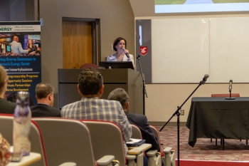 Sandra Haynes, Ph.D. speaking at the podium