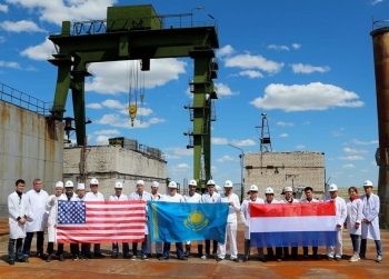 Employees celebrate after placement of all removed sources in the long-term storage cells at the Biakal-1 Reactor Complex in Kazakhstan.