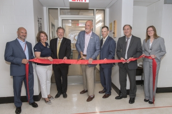 NNSA Associate Administrator and Deputy Under Secretary for Counterterrorism and Counterproliferation Jay Tilden cuts the ribbon for the renovated RAP 1 facility at Brookhaven National Laboratory in Brookhaven, New York.