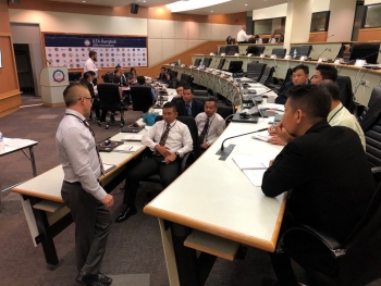 ASEANTOM exercise participants discuss the training during a breakout session.