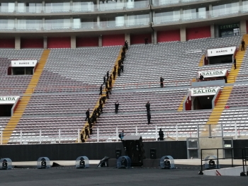 Peruvian National Police personnel performing sweeps of a venue with pagers and backpack radiation detectors