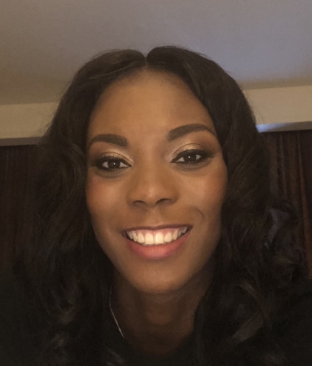 Shavone Brown smiles confidently.