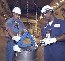 Using an A-Frame lifting hoist to safely relocate 9975s in the K Area Material Storage Facility.