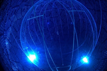 Fig. 1: Photograph of the upgraded Sudbury Neutrino Observatory (SNO+) Detector taken from inside the cavern. Fig. 1: Photograph of the upgraded Sudbury Neutrino Observatory (SNO+) Detector taken from inside the cavern.