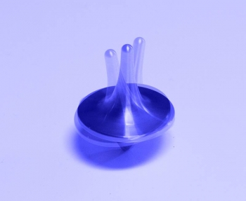 The axis of a toy top deviates in a circular path from its straight up and down alignment as the top spins around that axis. Knowing the rate of this deviation for spinning protons helps physicists keep the particles aligned in experiments. The axis of a toy top deviates in a circular path from its straight up and down alignment as the top spins around that axis. Knowing the rate of this deviation for spinning protons helps physicists keep the particles aligned in experiments.