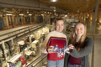 Shelter Island High School students Lauren Gurney and Emma Gallagher with a 3-D model of methylenetetrahydrofolate reductase (MTHFR), a protein involved in a range of diseases whose structure the students solved using x-rays at Brookhaven Lab. Shelter Island High School students Lauren Gurney and Emma Gallagher with a 3-D model of methylenetetrahydrofolate reductase (MTHFR), a protein involved in a range of diseases whose structure the students solved using x-rays at Brookhaven Lab.