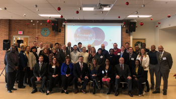 Photo of staff that assisted with preparation of the event. In front is the Honorable James E. Campos of the DOE and Michelle Christian of the SBA
