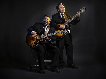 Los Alamos National Laboratory employees Lawrence Trujillo,left, and Eric Yee have played with several of New Mexico legends.