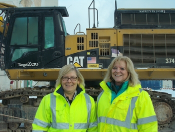 Lettie Chilson, left, CH2M HILL BWXT West Valley (CHBWV) facility manager, and Janice Williams, CHBWV vice president of regulatory strategy, stand in front of a cleanup project at EMâs West Valley Demonstration Project.