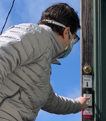 Igor Tregub of rings the bell of a Berkeley resident.