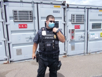 Security Police Officer Garrey with Securitas Critical Infrastructure Services, a contractor to EMâs West Valley Demonstration Project (WVDP), uses one of the siteâs new radios to talk with other officers at WVDP.