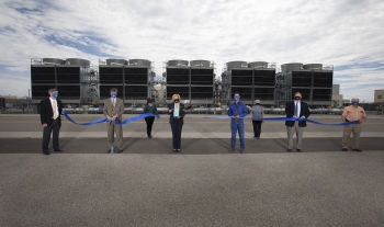 NNSA Administrator Lisa E. Gordon-Hagerty, accompanied by NNSA's partners from Los Alamos National Laboratory, cuts the ribbon for the Exascale Class Computer Cooling Equipment Project.