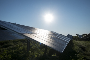 The sun shining on photovoltaic panels.