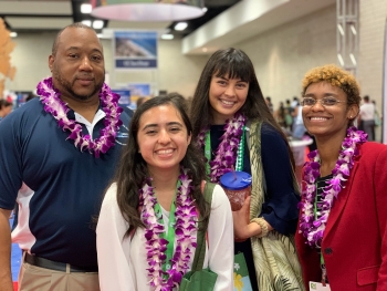 Alyssa Renteria (front center) is pictured here with Clarence Brown, director of the Mentorship for Environmental Scholars Program, and peers at a STEM diversity conference in Honolulu.