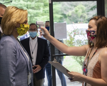 Before she entered any Y-12 building, NNSA Administrator Lisa E. Gordon-Hagerty followed the site's COVID-19 procedures, including a temperature check.