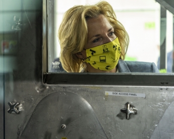NNSA Administrator Lisa E. Gordon-Hagerty peers at operations of the Y-12 Test and Demonstration Facility.