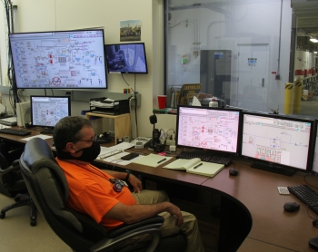 Steve Rust, a nuclear chemical operator for contractor CH2M HILL Plateau Remediation Company, monitors the performance of the 200 West Pump and Treat Facility from the control room on the Hanford Site.