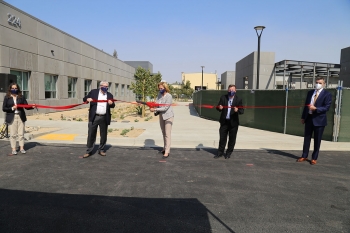 NNSA Administrator Lisa E. Gordon-Hagerty, joined by team members from NNSA and Lawrence Livermore National Laboratory, cuts the ribbon on the Lab's new Applied Materials and Engineering Campus.