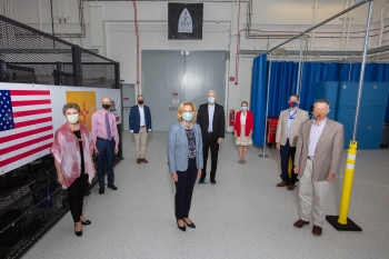 NNSA Administrator Lisa E. Gordon-Hagerty, flanked by members of the Sandia National Laboratories' California campus and NNSA staff, visits the Sandia Programs Engineering and Assembly Research facility.